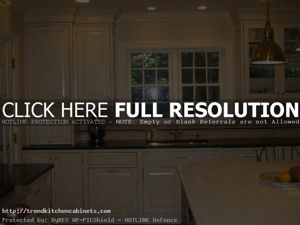 Cream Kitchen Cabinets With Black Granite Countertops